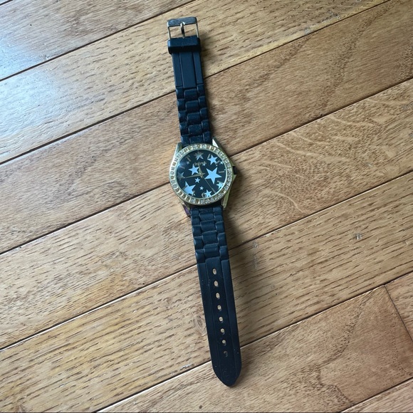 CLAIRES BLACK AND GOLD JELLY BAND STAR GRAPHIC WATCH - Picture 1 of 1